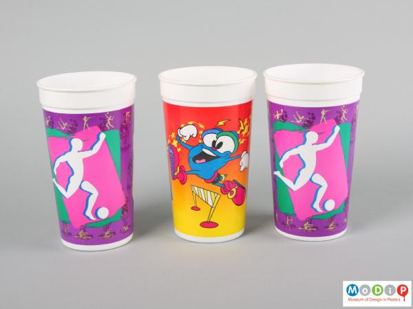 Side view of a group of beakers showing the printed decoration.