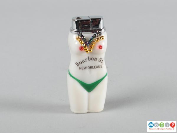 Front view of a lighter showing the beaded nipples and necklaces.