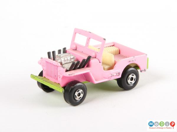 Side view of a toy vehicle showing the wheels and windscreen.