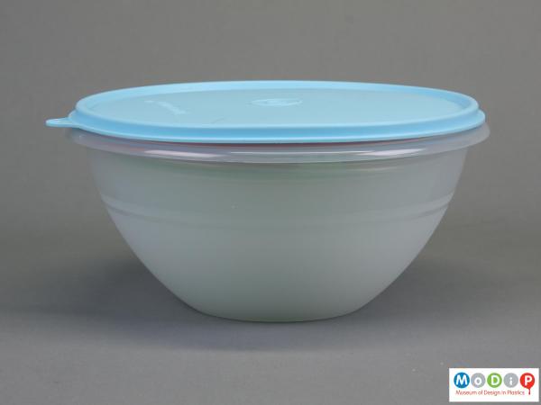 Side view of a storage bowl showing the pale blue lid and translucent base.