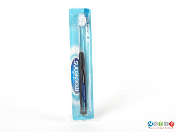 Front view of a toothbrush showing the straight handle.