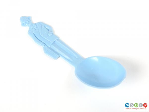 Top view of a Betterware spoon showing the moulded figure on the handle.