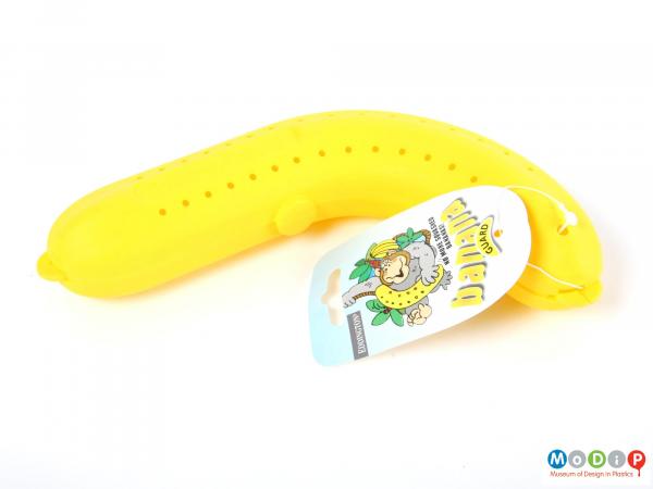 Side view of a Banana Guard showing the guard along with the sales swing tag.