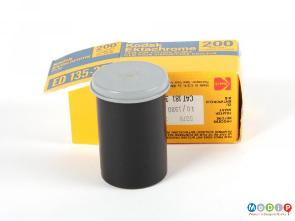 Side view of film packaging showing the canister and the box.