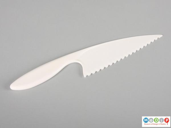 Side view of a lettuce knife showing the large blade.
