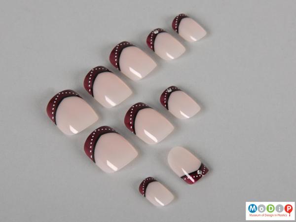Top view of a set of false nails showing some of the different sizes.