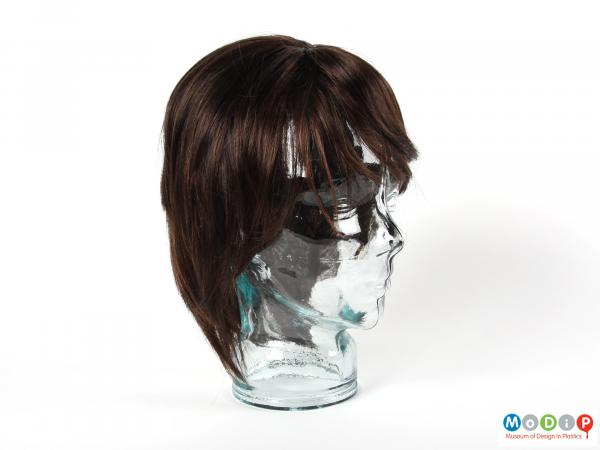 Side view of a wig showing the style and colour.