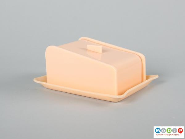 Side view of a butter dish showing the straight sides.