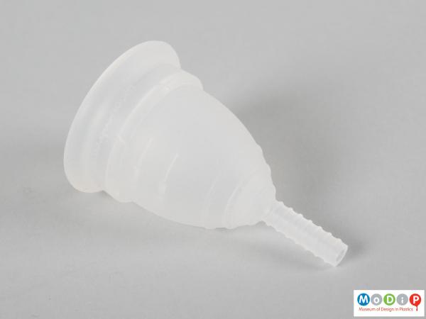 Side view of a menstrual cup showing ergonomic shaping.