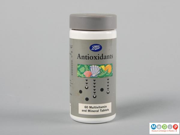 Front view of a supplements bottle showing the cylindrical shape.