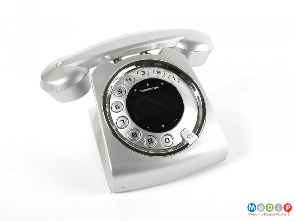 Top view of a telephone showing the buttons in a circle like a traditional dial.