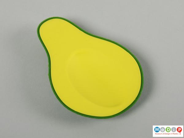 Top view of a spoon rest showing the avocado shape.