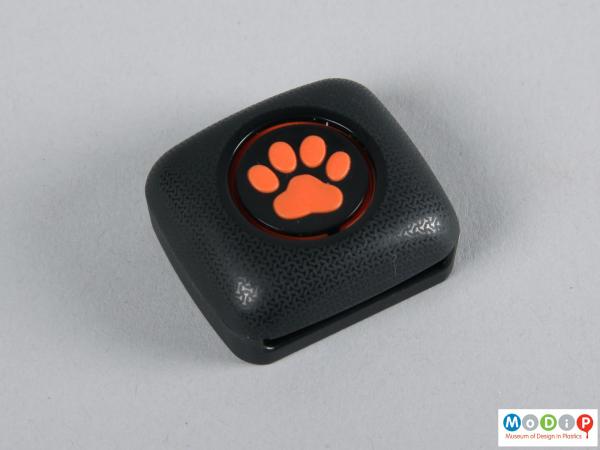 Top view of a tracker showing the paw print logo.