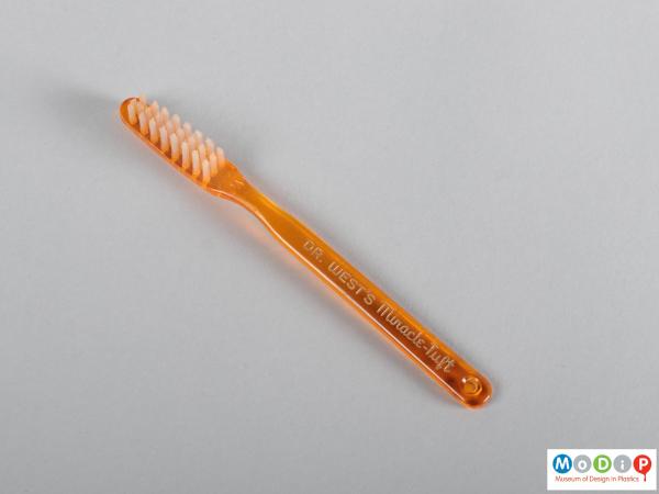 Side view of a toothbrush showing