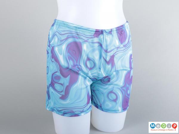 Front view of a pair of swim shorts showing the printed pattern.