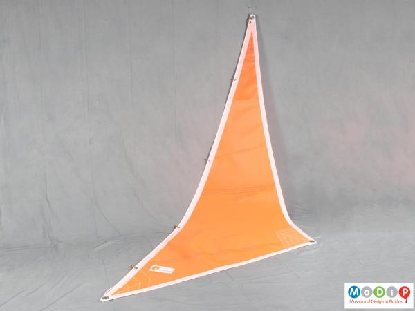 Side view of a sail showing the triangular shape.