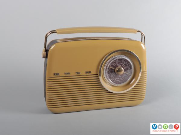 Front view of a radio showing the round tuning dial and curved corners.