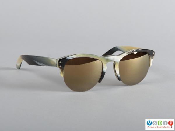 Front view of a pair of sunglasses showing the D-shape lens.