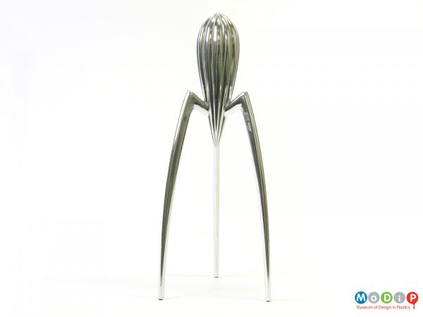 Side view of a Juicy Salif juicer showing the three legs and the juicer's body.