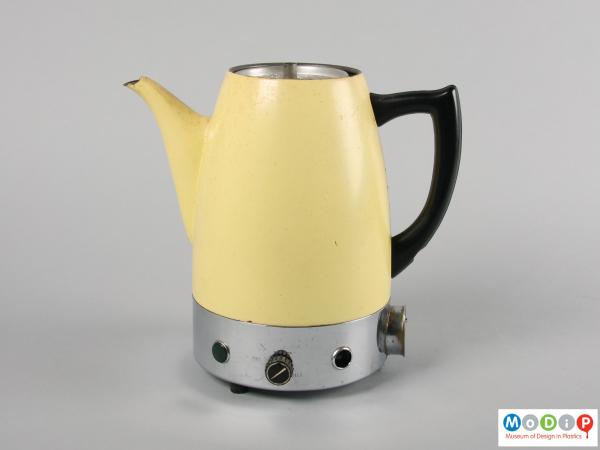 Side view of a coffee pot showing the handle and spout.