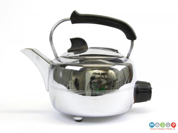 Side view of a Swan kettle showing the round body and curved handle.