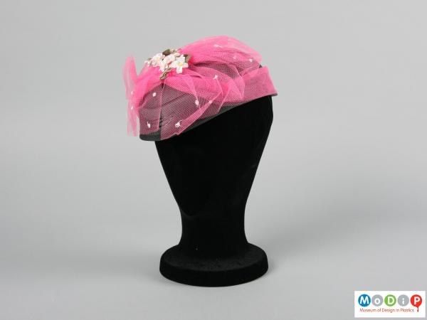 Front view of a hat showing the pink netting.