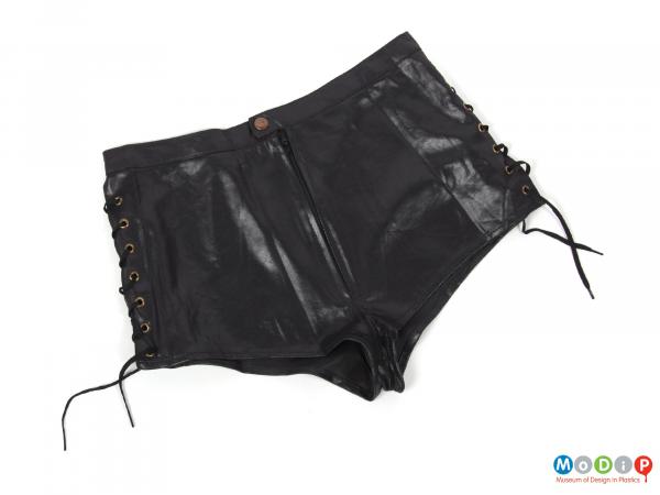 Front view of a pair of shorts showing the popper fastener.