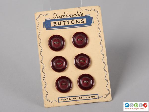 Front view of a sales card of Fashionable buttons showing three rows of two buttons.