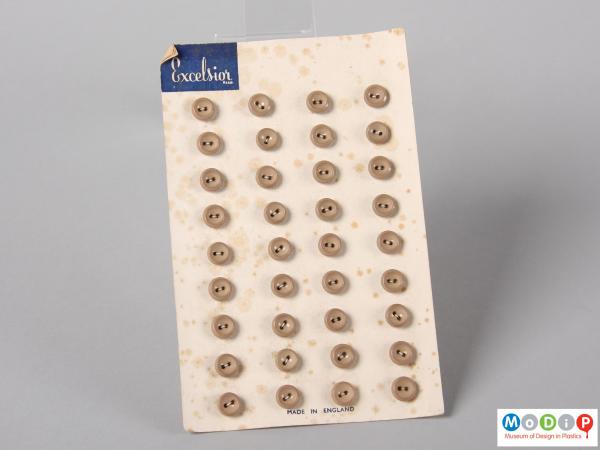 Front view of an Excelsior button sales card showing four complete columns of buttons.