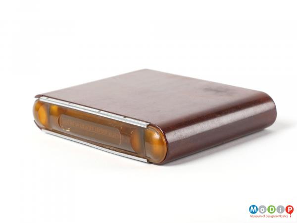 Top view of a 1950s cigarette case showing the case on its side and the lid closed.