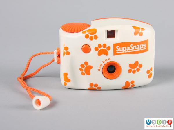 Front view of a camera showing paw print decoration.