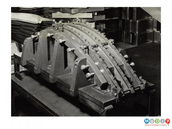 Scanned image showing a drilling jig.