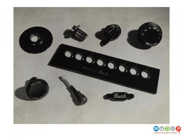 Scanned image showing a range of control knobs.