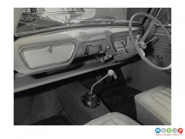 Scanned image showing the interior of a Ford Anglia.