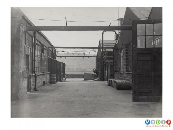 Scanned image showing the exterior of a factory.