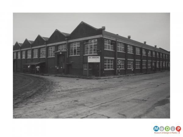 Scanned image showing the exterior of a factory building.