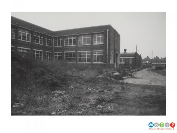 Scanned image showing the exterior of  a factory building.