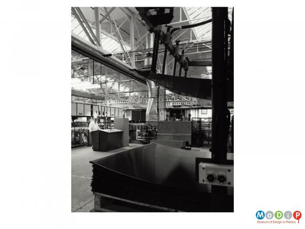 Scanned image showing a view of a factory floor.