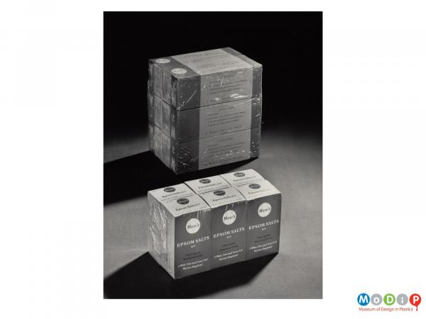 Scanned image showing sets o6 packets of Epsom Salts shrink wrapped together.