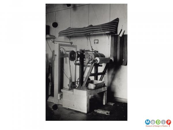 Scanned image showing a cutting machine.