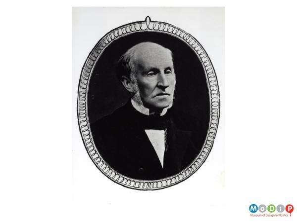 Scanned image showing an oval portrait of a balding man.