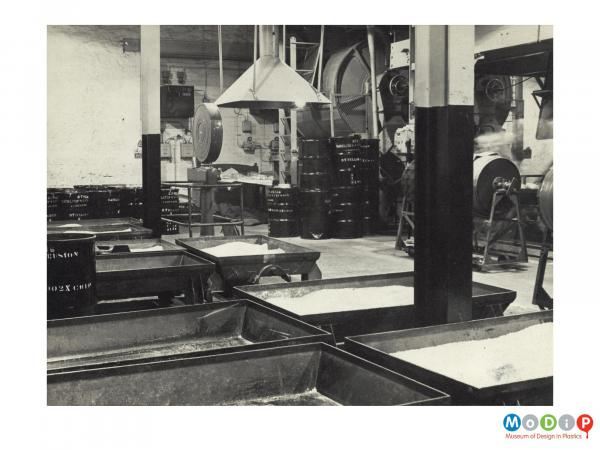 Scanned image showing an internal view of storage room in a factory.