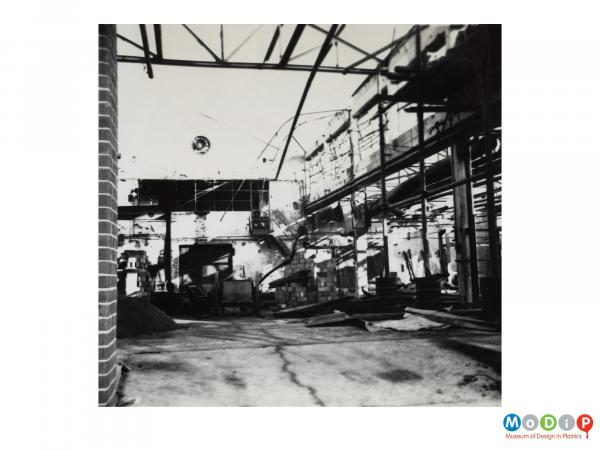 Scanned image showing the interior of a derelict building.