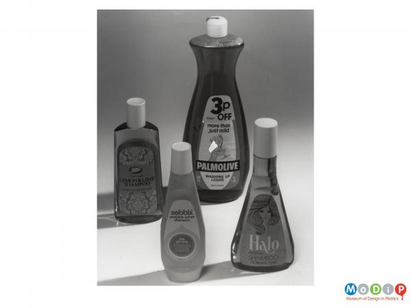 Scanned image showing four bottles of shampoo.