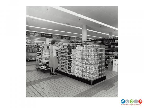 Scanned image showing a woman in a supermarket.