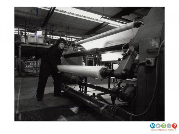Scanned image showing the production of plastic sheet.