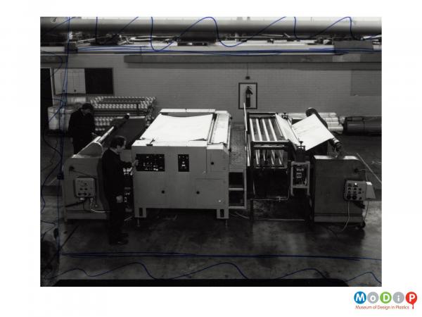 Scanned image showing the production of plastic sheet.