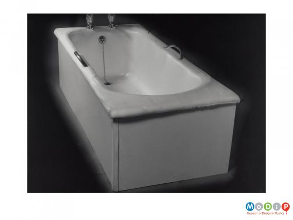 Scanned image showing a bath lined with a plastic material.