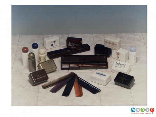 Scanned image showing a range of toiletry products including combs, bottles and boxes.