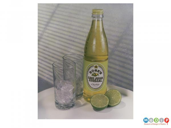 Scanned image showing a cordial bottle and some glasses.
